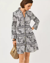 Load image into Gallery viewer, Woman wearing a zebra-print shirtdress with Greek key trim, holding a woven handbag