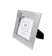 Load image into Gallery viewer, Mariposa decorative photo frame featuring an ornate cross embellishment, polished metallic finish with easel back