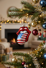 Load image into Gallery viewer, Rolling Stones iconic lips and tongue logo ornament featuring American flag design, hanging on Christmas tree
