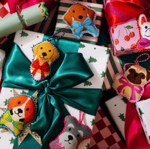 Load image into Gallery viewer, Handcrafted needlepoint beagle dog ornament displayed on festively wrapped holiday gifts
