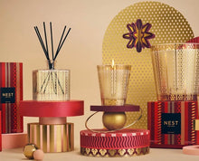 Load image into Gallery viewer, NEST New York Holiday red and gold reed diffuser, lit candle, and votive set