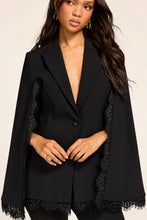 Load image into Gallery viewer, Black structured cape blazer with scalloped lace trim edges and single button closure
