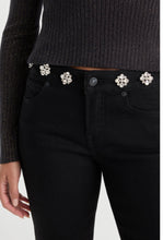 Load image into Gallery viewer, Black skinny jeans featuring sparkling crystal flower embellishments along the waistband