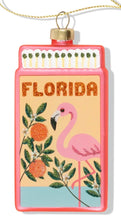 Load image into Gallery viewer, Pink glass Florida matchbox ornament with flamingo, oranges, and glitter accents