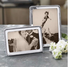 Load image into Gallery viewer, Mariposa Beaded Frame displaying cherished black-and-white family photos, adorned with elegant beaded border detailing