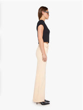 Load image into Gallery viewer, Cream wide-leg trousers with flap pockets, styled with black crop top and heels