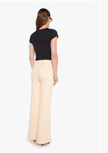 Load image into Gallery viewer, Wide-leg cream trousers shown from back, paired with black fitted tee