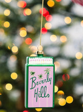 Load image into Gallery viewer, Pink and green glass matchbook ornament with Beverly Hills text and palm trees