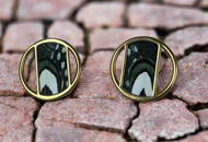 Gold-plated circle stud earrings with black and white butterfly feather inlay on stone