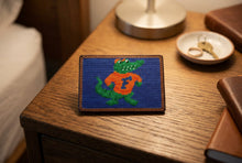 Load image into Gallery viewer, Smathers &amp; Branson needlepoint card wallet featuring University of Florida's Albert the Alligator mascot on nightstand