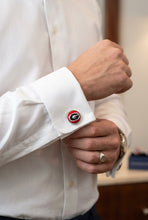 Load image into Gallery viewer, Man fastening his dress shirt cuff adorned with a University of Georgia needlepoint cufflink