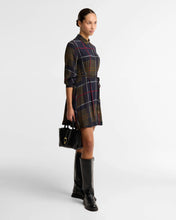Load image into Gallery viewer, Woman wearing Barbour Ivybridge Mini Dress Tartan with knee-high boots and handbag
