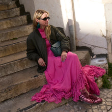 Load image into Gallery viewer, Woman wearing green tassel drop earrings with pink dress and olive bomber jacket