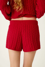 Load image into Gallery viewer, Woman wearing cozy cable knit chenille shorts with matching cropped sweater, back view