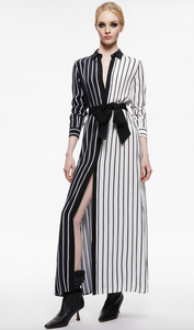 This Alice & Olivia Dress features a collard neckline and belted waistline. This long-sleeved style is split between being black with white stripes on one side while being white with black stripes on the other.