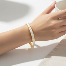 Load image into Gallery viewer, Halcyon Days Skinny Star Hinged Bangle with gold star motifs worn on wrist