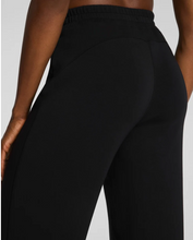 Load image into Gallery viewer, Spanx Airessential Petite Straight Pant in black with elastic waistband, back view