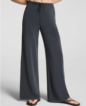 Load image into Gallery viewer, Spanx wide-leg drawstring pants in washed graphite worn with flip-flops