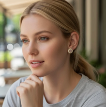 Load image into Gallery viewer, Woman wearing elegant circular stud earrings with natural stone and gold detailing