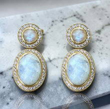 Load image into Gallery viewer, Tat2 Rainbow Moonstone Drop Forte Earrings featuring oval gemstones surrounded by sparkling diamond halos in gold settings