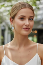 Load image into Gallery viewer, Model wearing elegant double drop rainbow moonstone earrings with gold setting, styled for a formal occasion