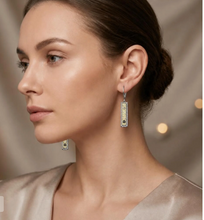 Load image into Gallery viewer, Model wearing Tat2 Vintage Silver Soleil ID drop earrings with intricate decorative detailing