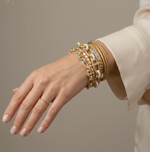 Load image into Gallery viewer, Gold ID bar bracelet stacked with gold chain bracelets on wrist