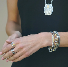 Load image into Gallery viewer, Tat2 Vintage Silver Soleil ID Bracelet styled with stacked bracelets and rings on wrist