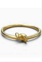 Load image into Gallery viewer, Tat2 Noa Knot Bangle featuring a smooth circular band with a sculptural knot detail