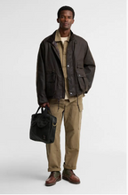 Load image into Gallery viewer, Barbour Field Wax dark brown jacket worn with khaki cargo pants and brown boots