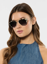 Load image into Gallery viewer, Woman wearing Krewe Coleman Blinker 12K Bone aviator sunglasses with tortoise acetate and metal frames