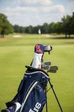 Load image into Gallery viewer, A golf club headcover featuring the 'Ole Miss' logo in red and white on a navy blue top section, with a white lower body and a red number '1' near the bottom.