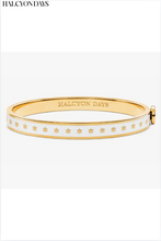 Load image into Gallery viewer, Halcyon Days cream and gold enamel hinged bangle with star pattern design