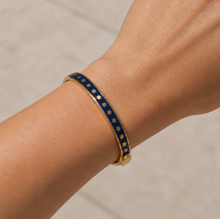 Load image into Gallery viewer, Halcyon Days Skinny Star Hinged Bangle worn on wrist featuring enamel star pattern