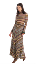 Load image into Gallery viewer, Model wearing a long chevron patterned maxi skirt with matching turtleneck top and belt