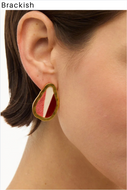 Gold-framed stud earring with ivory, red, and pink feather inlay on model