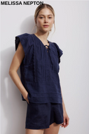 Navy linen high-rise shorts with relaxed fit and topstitched hem, front patch pockets