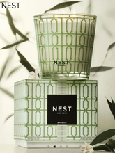 Load image into Gallery viewer, NEST New York Bamboo 3-wick candle in green geometric patterned glass jar with matching gift box