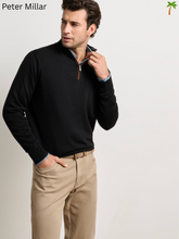 Load image into Gallery viewer, Men's black merino quarter-zip sweater layered over blue chambray shirt with khaki pants