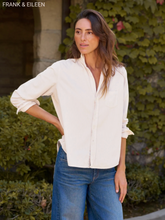 Load image into Gallery viewer, Woman wearing a relaxed corduroy button-up shirt with rolled sleeves and wide-leg jeans