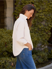 Load image into Gallery viewer, Woman wearing an oversized corduroy button-up shirt tucked into wide-leg jeans outdoors