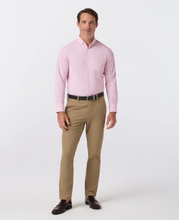 Load image into Gallery viewer, Man wearing a slim-fit plaid long-sleeve dress shirt tucked into chino pants