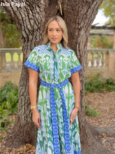Load image into Gallery viewer, Woman wearing a printed midi shirtdress with belt, short sleeves, and collar outdoors