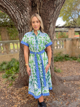 Load image into Gallery viewer, Woman wearing a midi-length ikat print shirtdress with belt and short sleeves