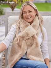 Load image into Gallery viewer, Smiling woman wearing a luxurious faux fur scarf while seated outdoors