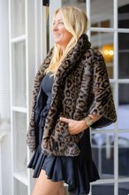 Load image into Gallery viewer, Woman wearing a luxurious leopard print faux fur capelet over a chic mini dress