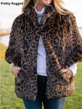 Load image into Gallery viewer, Woman wearing a luxurious faux fur leopard print capelet with front pockets