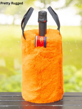 Load image into Gallery viewer, Fluffy faux fur wine bottle tote bag with black handles holding a champagne bottle