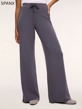 Load image into Gallery viewer, Spanx wide leg pants with drawstring waistband, flowing silhouette, worn with flat shoes