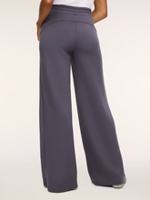 Load image into Gallery viewer, Spanx wide leg pants shown from the back with elastic waistband and flowing silhouette